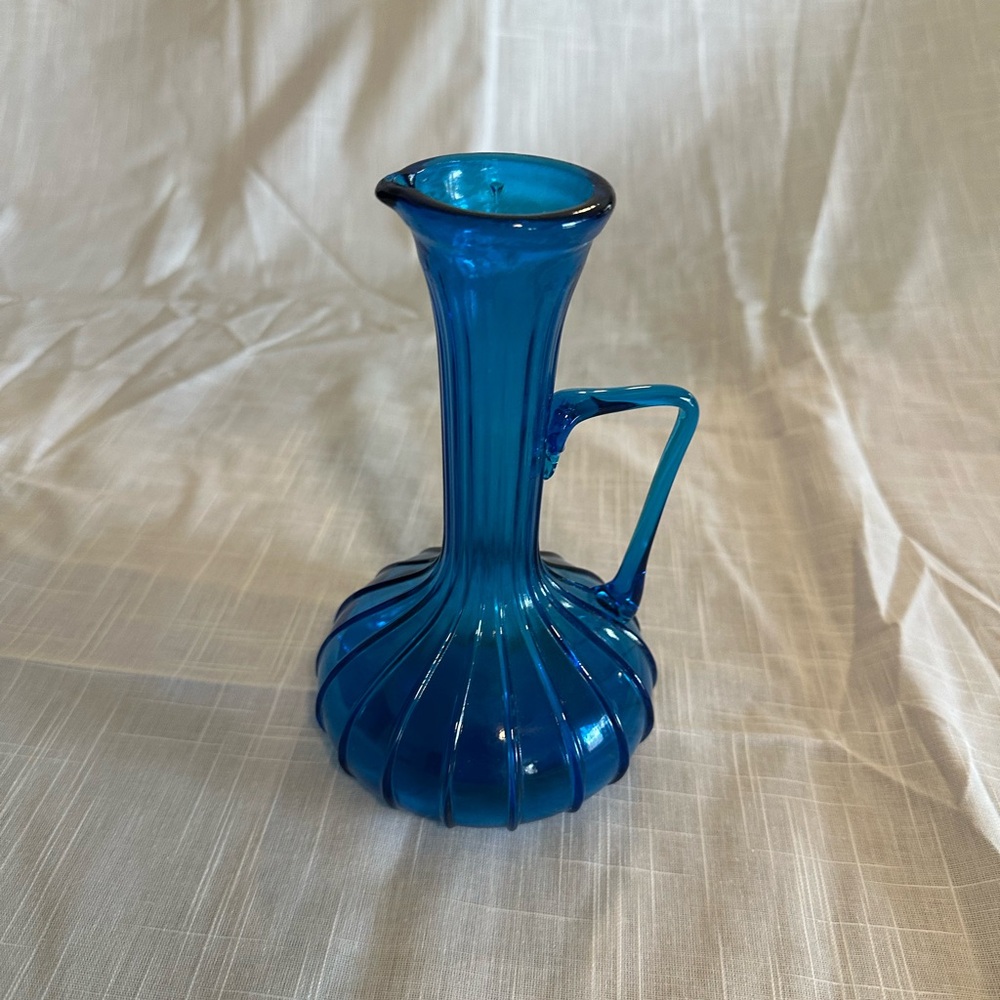 Vintage Empoli glass Rossini blue genie bottle decanter manufactured in Italy.